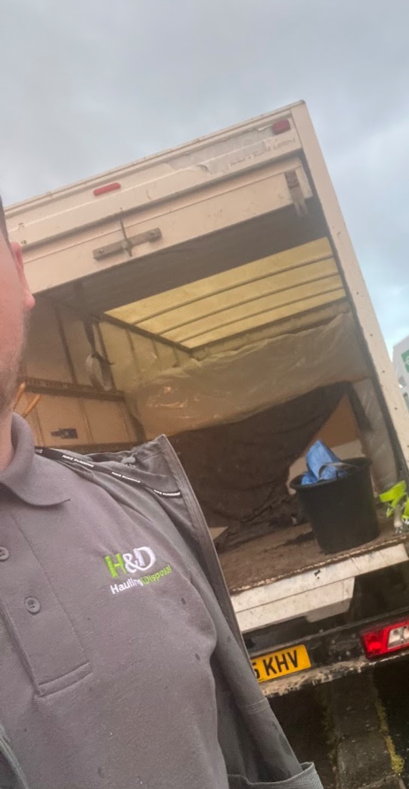 Hauling & Disposal team member beside the company Luton van